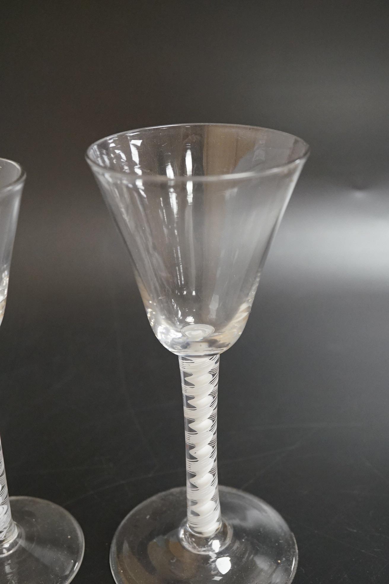 Two DSOT stem wine glasses, c.1760, with funnel shaped bowls, tallest 16.5cm high